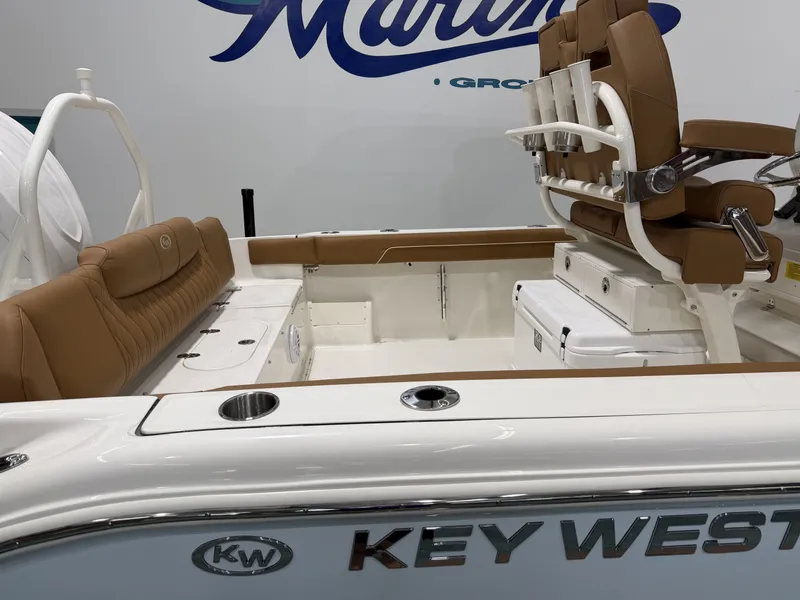Slide: The Image of Interior of Key West 239 FSR boat, 2026 model, featuring brown leather seats. - 6