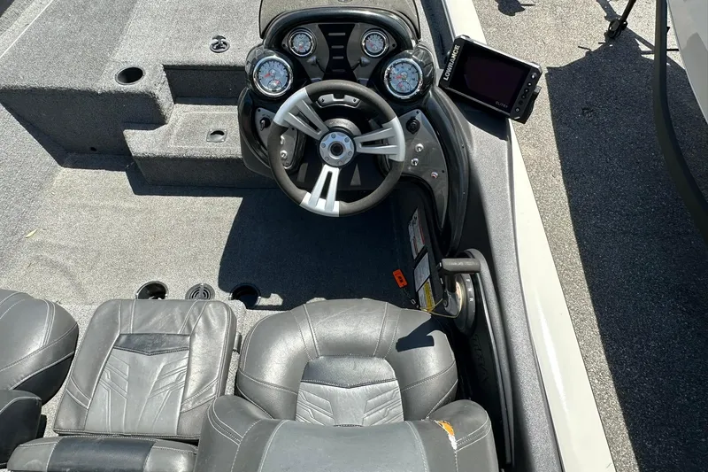 Slide: The Image of 2019 Tracker Pro Team 175 TXW Tournament Edition boat cockpit with steering wheel and gauges. - 10