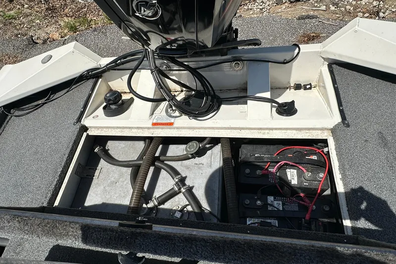 Slide: The Image of 2019 Tracker Pro Team 175 TXW Tournament Edition boat battery compartment with wiring and components. - 18