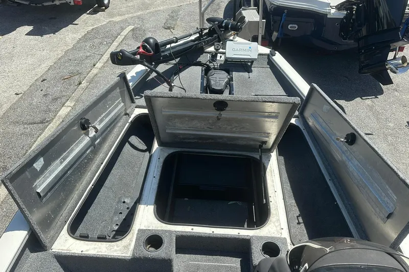 Slide: The Image of 2019 Tracker Pro Team 175 TXW Tournament Edition boat with open storage compartments. - 6