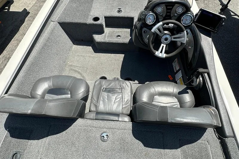 Slide: The Image of 2019 Tracker Pro Team 175 TXW Tournament Edition boat interior with steering console and seating. - 9