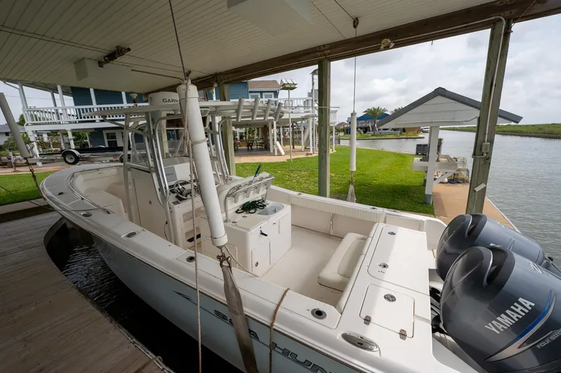 Slide: The Image of 2007 Sea Hunt Triton 290 boat docked with dual Yamaha engines. - 10