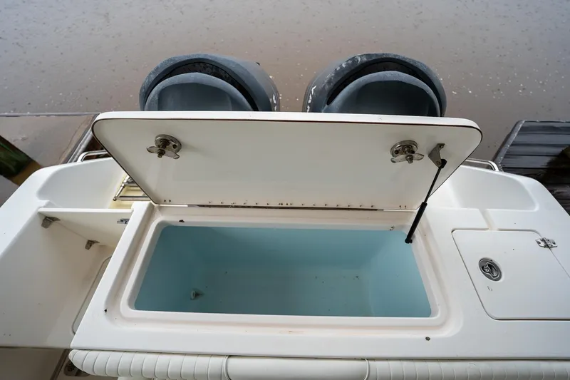 Slide: The Image of Open storage compartment on a 2007 Sea Hunt Triton 290 boat. - 14
