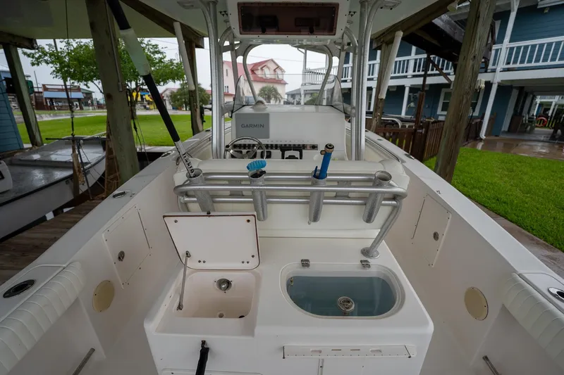 Slide: The Image of 2007 Sea Hunt Triton 290 boat interior with fishing rod holders and equipment. - 16