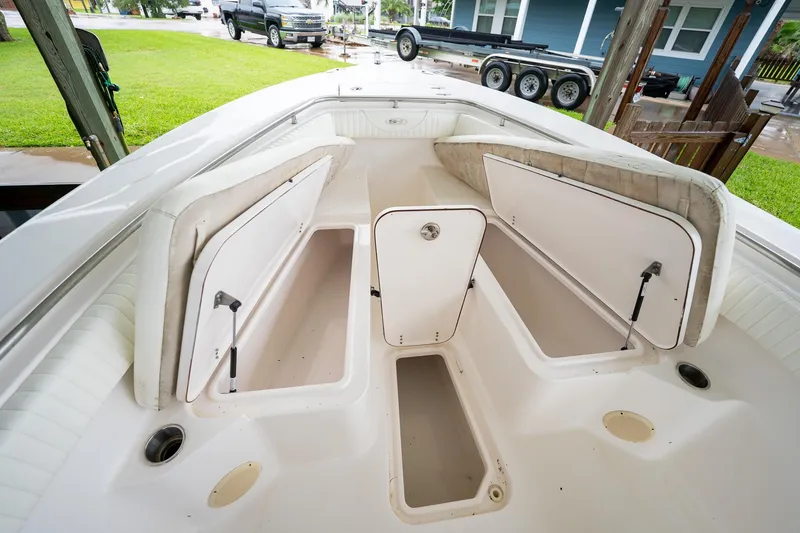 Slide: The Image of 2007 Sea Hunt Triton 290 boat interior with open storage compartments. - 35