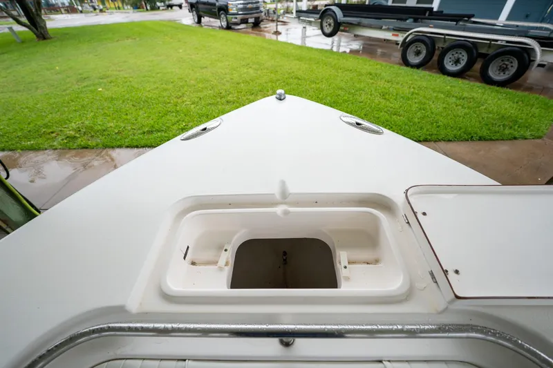 Slide: The Image of Bow view of 2007 Sea Hunt Triton 290 boat with open storage compartment. - 36