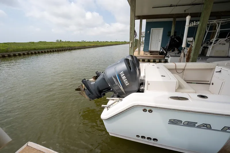 Slide: The Image of 2007 Sea Hunt Triton 290 boat docked with Yamaha outboard motor. - 7