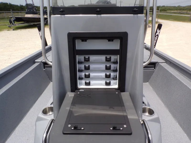 Slide: The Image of Xpress SW22B 2026 boat featuring storage and fishing gear. - 19