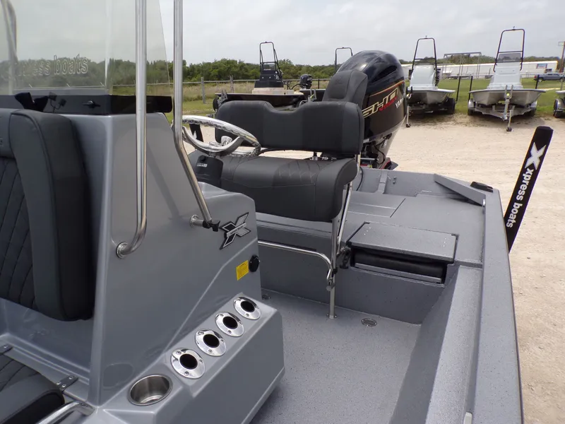Slide: The Image of 2026 Xpress SW22B boat with Yamaha engine, gray interior. - 29