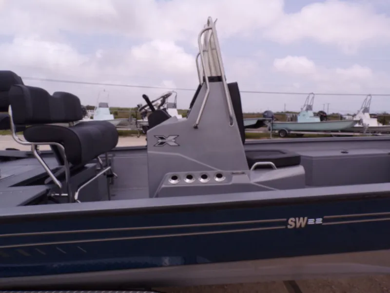 Slide: The Image of 2026 Xpress SW22B boat with modern seating and console. - 34