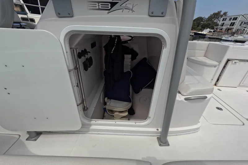 Slide: The Image of 2011 Donzi 38 ZFX Open boat cabin with storage and seating area. - 11