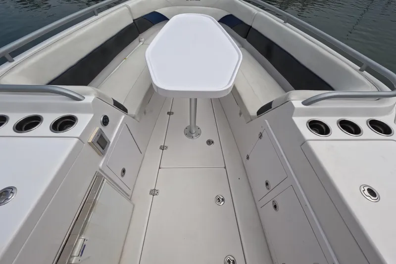 Slide: The Image of 2011 Donzi 38 ZFX Open boat interior with seating and table setup. - 37