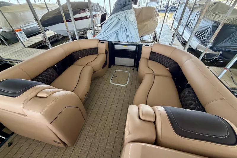 Slide: The Image of 2023 Barletta Lusso 23U pontoon boat interior with luxurious tan seating. - 10