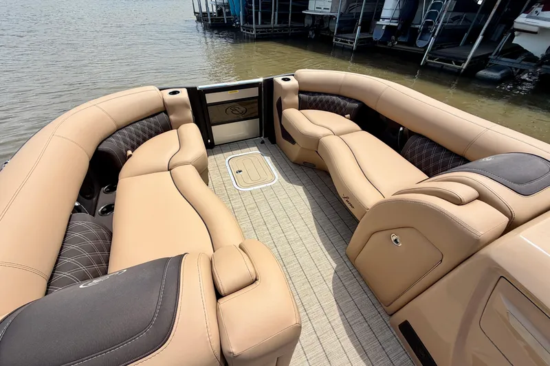 Slide: The Image of Luxurious 2023 Barletta Lusso 23U pontoon boat interior with plush tan seating. - 11
