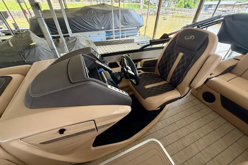 Slide: The Image of 2023 Barletta Lusso 23U boat interior with luxurious seating and modern dashboard design. - 17