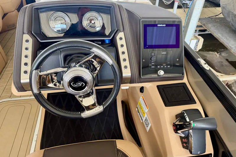 Slide: The Image of 2023 Barletta Lusso 23U dashboard with steering wheel and control panel. - 20