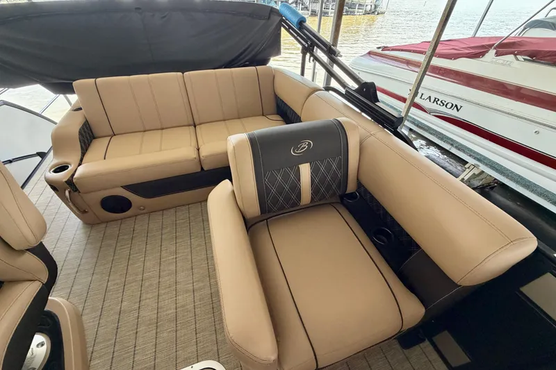 Slide: The Image of Luxurious seating on 2023 Barletta Lusso 23U pontoon boat, featuring elegant tan upholstery. - 23