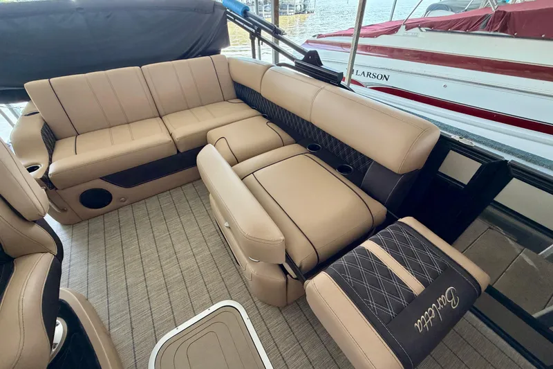 Slide: The Image of Luxurious seating on 2023 Barletta Lusso 23U pontoon boat, featuring elegant tan upholstery. - 27