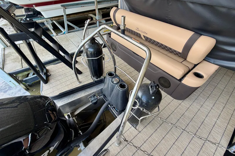 Slide: The Image of 2023 Barletta Lusso 23U boat interior with tan seating and stainless steel railings. - 36