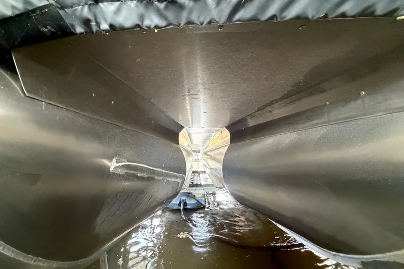 Slide: The Image of Underneath view of 2023 Barletta Lusso 23U pontoon boat hull in water. - 42