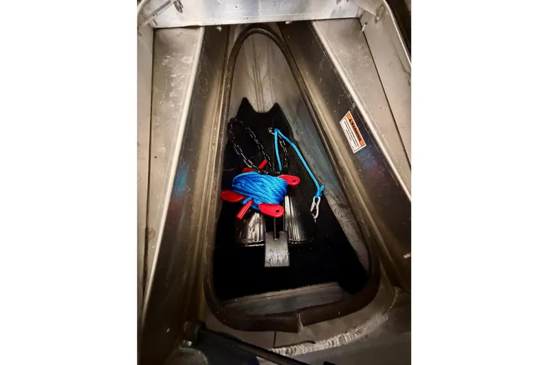 Slide: The Image of Storage compartment of 2023 Barletta Lusso 23U with blue rope and chain. - 43