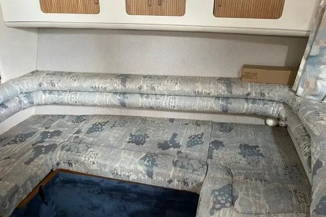 Slide: The Image of Interior seating area of a 1993 Sea Ray Sundancer 330 boat. - 10
