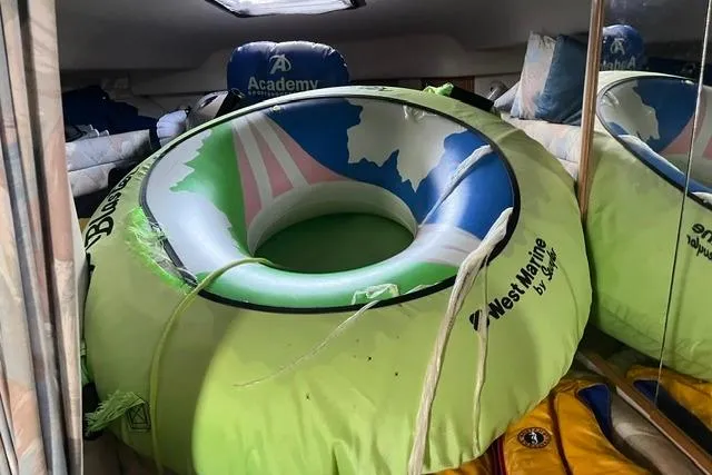 Slide: The Image of Inflatable tube stored inside a 1993 Sea Ray Sundancer 330 cabin. - 12