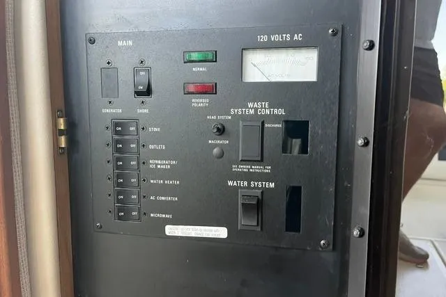 Slide: The Image of Control panel of a 1993 Sea Ray Sundancer 330 boat, featuring electrical and waste system controls. - 15