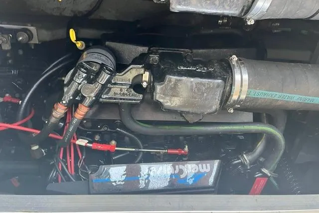 Slide: The Image of Engine compartment of a 1993 Sea Ray Sundancer 330 with visible wiring and components. - 17