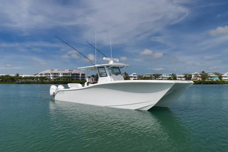 The Image of 2024 Costa Custom Boats 34SV on calm water under a clear blue sky. - 1