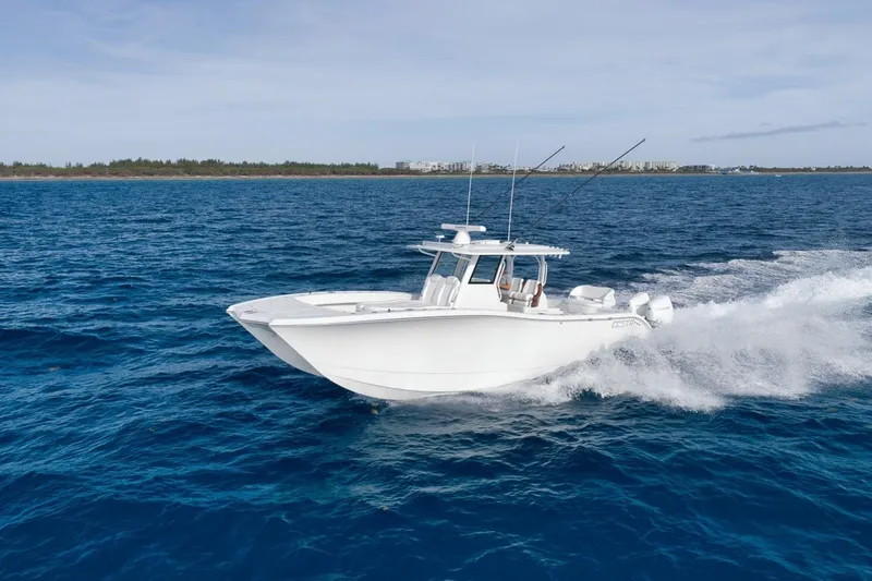 Slide: The Image of 2024 Costa Custom Boats 34SV cruising on open blue ocean waters. - 12