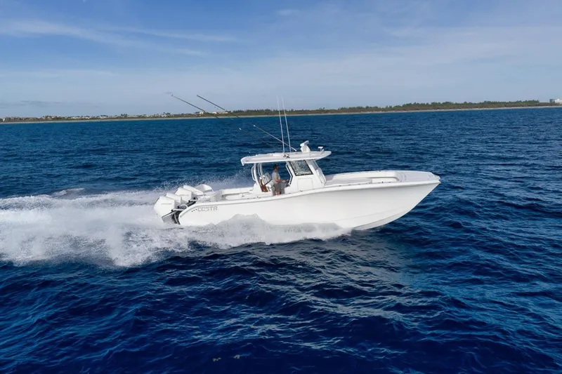 Slide: The Image of 2024 Costa Custom Boats 34SV cruising on open blue water. - 13