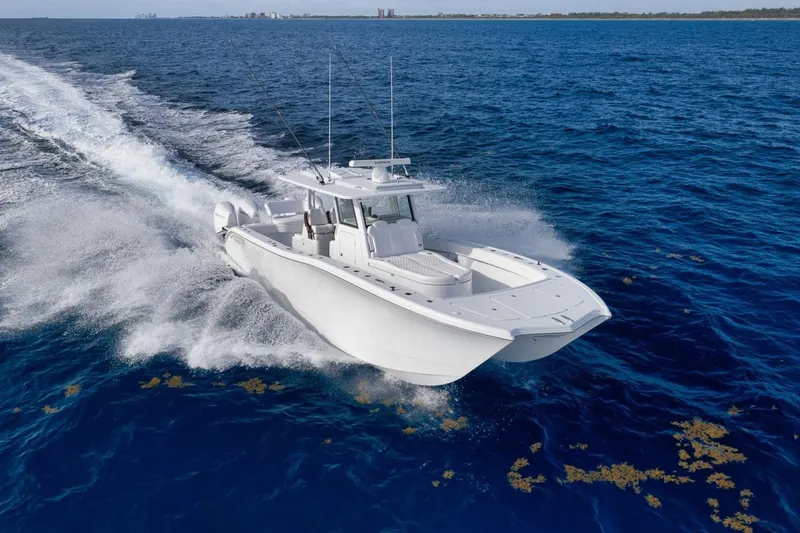 Slide: The Image of 2024 Costa Custom Boats 34SV cruising on open ocean waters. - 14