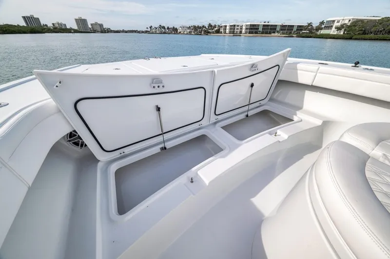 Slide: The Image of 2024 Costa Custom Boats 34SV with open storage compartments on deck. - 23