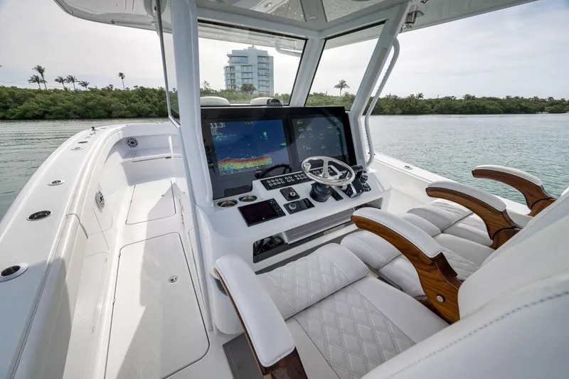 Slide: The Image of 2024 Costa Custom Boats 34SV helm with advanced navigation system and luxurious seating. - 28