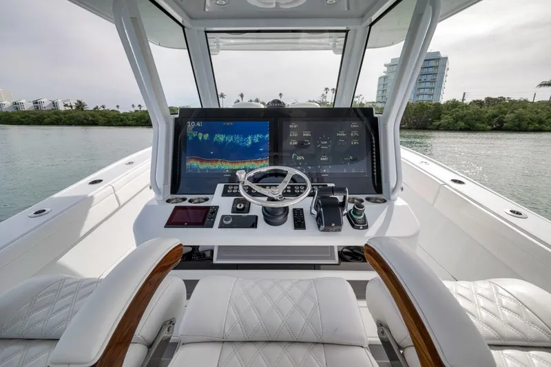 Slide: The Image of 2024 Costa Custom Boats 34SV helm with advanced navigation displays and luxurious seating. - 29
