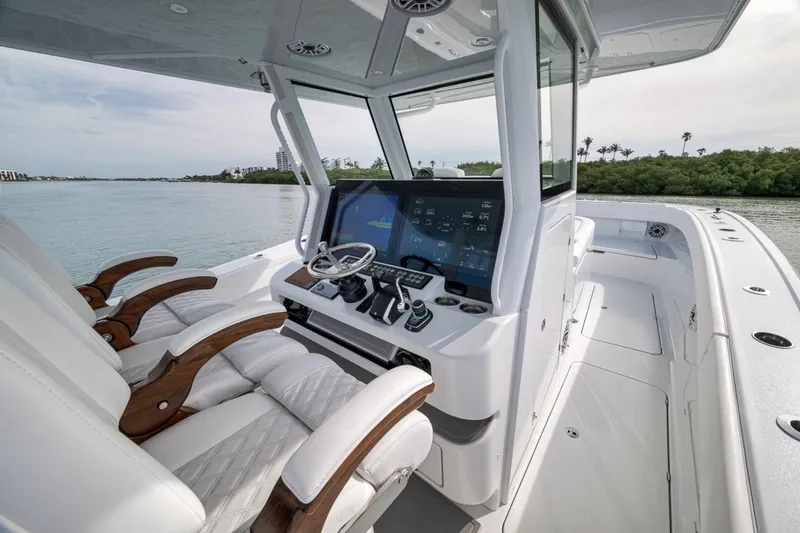 Slide: The Image of 2024 Costa Custom Boats 34SV helm with advanced navigation system and luxurious seating. - 30