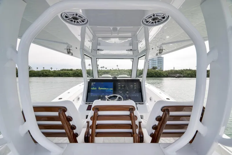 Slide: The Image of 2024 Costa Custom Boats 34SV interior with advanced navigation system and luxurious seating. - 32
