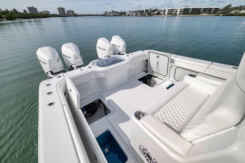 Slide: The Image of 2024 Costa Custom Boats 34SV with Mercury engines on calm water. - 35
