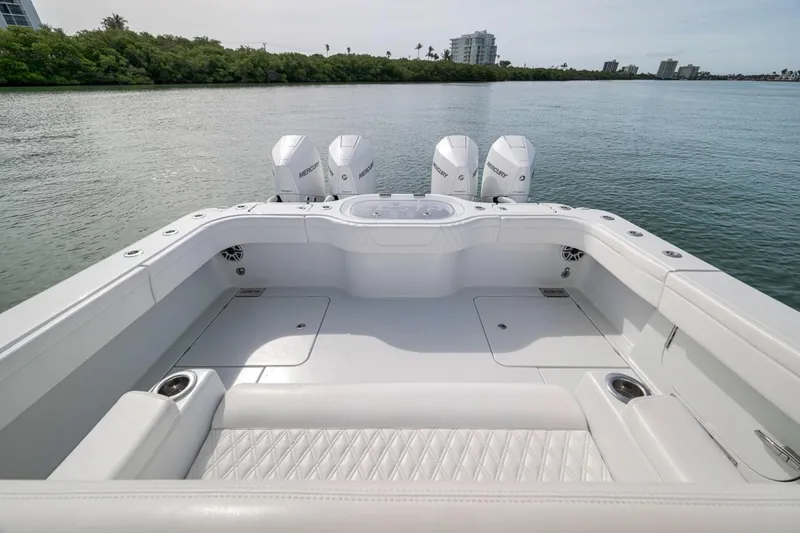 Slide: The Image of 2024 Costa Custom Boats 34SV with triple Mercury engines on calm water. - 36
