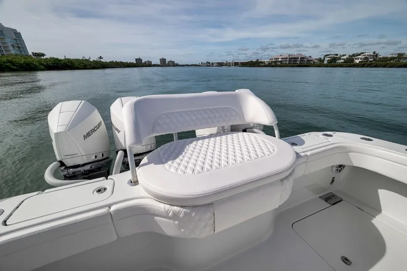 Slide: The Image of 2024 Costa Custom Boats 34SV with dual Mercury engines on a serene waterway. - 37