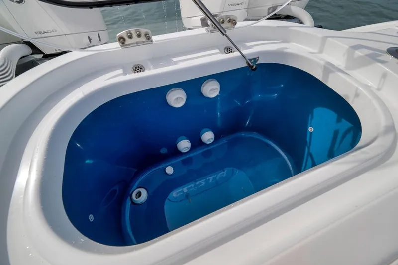 Slide: The Image of 2024 Costa Custom Boats 34SV livewell with blue interior and white exterior. - 38