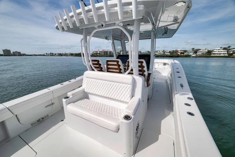 Slide: The Image of 2024 Costa Custom Boats 34SV on calm water, featuring sleek seating and modern design. - 40