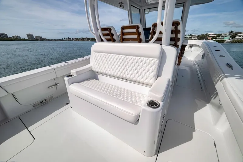 Slide: The Image of 2024 Costa Custom Boats 34SV with luxurious seating, cruising on calm waters. - 41