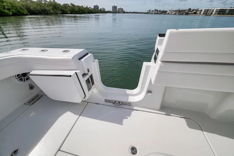 Slide: The Image of 2024 Costa Custom Boats 34SV, rear deck view with open water backdrop. - 47