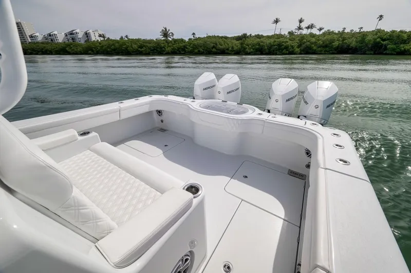 Slide: The Image of 2024 Costa Custom Boats 34SV with quad Mercury engines on calm water. - 48