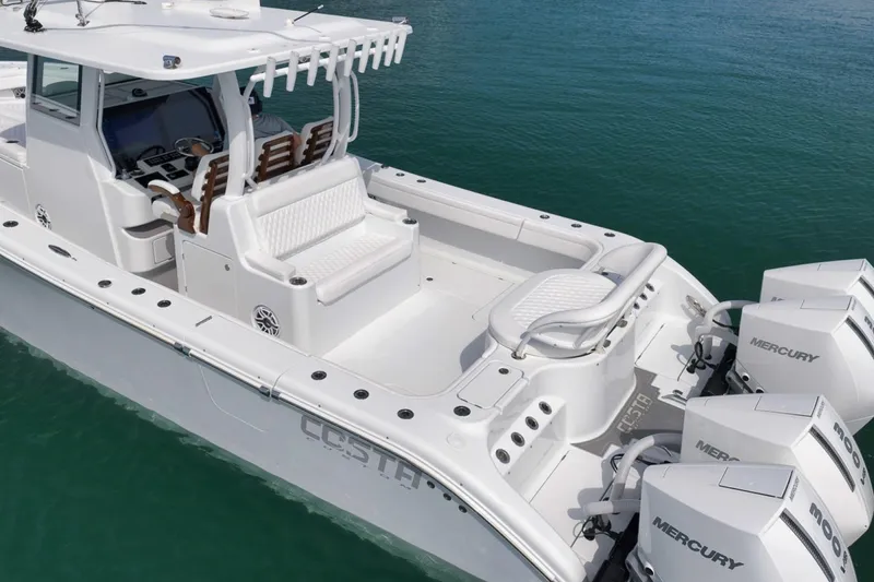 Slide: The Image of 2024 Costa Custom Boats 34SV with Mercury engines on calm water. - 6