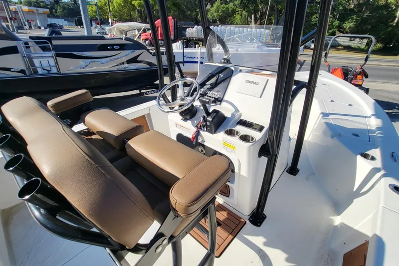 Slide: The Image of 2019 Sea Pro 208 Bay boat interior with steering console and seating. - 5