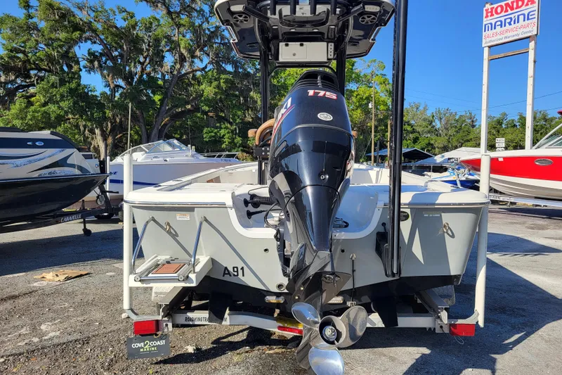 Slide: The Image of 2019 Sea Pro 208 Bay boat with 175 HP engine at a marine dealership. - 8