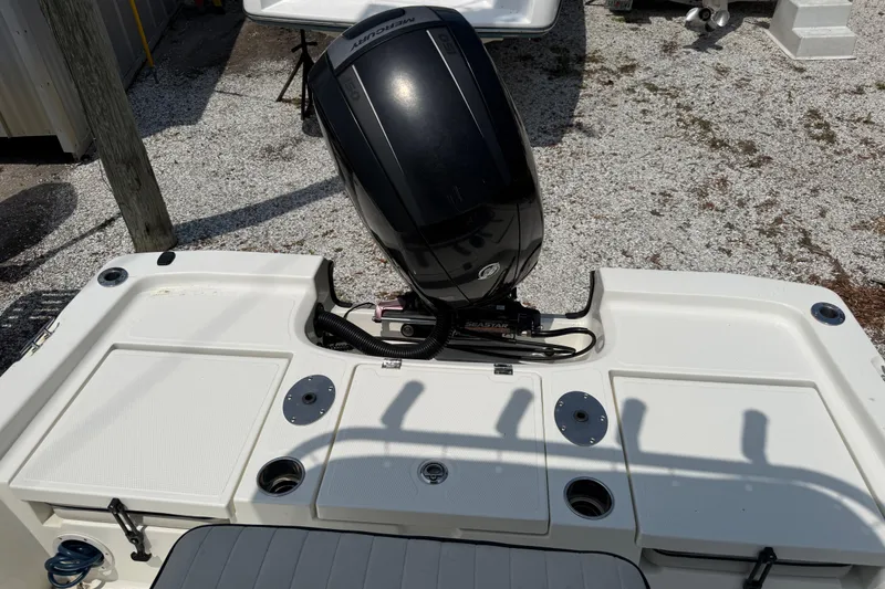 Slide: The Image of 2017 Mako 19 CPX boat with Mercury outboard motor, rear deck view. - 10